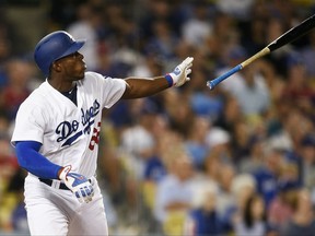 Los Angeles Dodgers' Yasiel Puig tosses his bat after hitting a solo home run against the Minnesota Twins during the fifth inning of a baseball game in Los Angeles, Wednesday, July 26, 2017. (AP Photo/Kelvin Kuo)