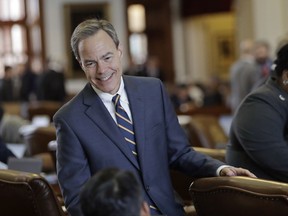 FILE - In this April 19, 2017, file photo, Texas Speaker of the House Joe Straus, R-San Antonio, talks with fellow lawmakers on the House floor at the Texas Capitol in Austin. Straus says he doesn't want a "suicide" on his hands over a so-called bathroom bill that Gov. Greg Abbott  is ordering lawmakers to revive later this month. LGBT rights groups say efforts to restrict which bathrooms transgender people can use are discriminatory and could elevate the risk of suicides. Backers of the bill say privacy protections are needed. (AP Photo/Eric Gay, File)