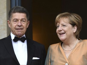 German Chancellor Angela Merkel and her husband Joachim Sauer arrive for the opening of the opera festival in Bayreuth, Germany, Tuesday, July 25, 2017. The Richard Wagner Festival will be opened with the opera "The Master-Singers of Nuremberg". (Tobias Hase/dpa via AP)