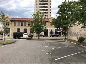 A police vehicle is parked outside the entrance of an Arkansas nightclub where police say multiple people were shot, Saturday, July 1, 2017.  (AP Photo/Andrew DeMillo)