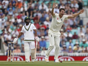 England's Toby Roland-Jones celebrates taking the wicket of South Africa's Temba Bavuma, left, on the fifth day of the third test match between England and South Africa at The Oval cricket ground in London, Monday, July 31, 2017. (AP Photo/Kirsty Wigglesworth)