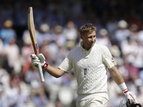 England captain Joe Root walks off the field of play after losing his wicket for 190 runs off the bowling of South Africa's Morne Morkel during the first test between England and South Africa at Lord's cricket ground in London, Friday, July 7, 2017. (AP Photo/Matt Dunham)