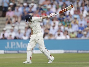 England captain Joe Root swings his bat in frustration as he walks off the field of play after losing his wicket from the bowling of South Africa's Keshav Maharaj during the first test between England and South Africa at Lord's cricket ground in London, Sunday, July 9, 2017. (AP Photo/Matt Dunham)