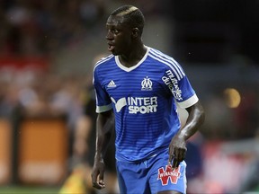 FILE - In this Friday, Aug. 28, 2015 file photo, Marseille's defender Benjamin Mendy controls the ball during their French League One soccer match against Guingamp at the Roudourou stadium in Guingamp, western France. Manchester City has announced on Monday, July 24, 2017 the signing of left-back Benjamin Mendy from Monaco. The 23-year-old Frenchman was part of the Monaco team which won last season's French title and knocked out City on its way to the Champions League semifinals. (AP Photo/David Vincent, file)