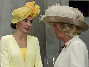 Britain's Camilla, Duchess of Cornwall, right, greets Spain's  Queen Letizia at a hotel in London, Tuesday July 12, 2017.  The King and Queen of Spain are on a three day State Visit to Britain. (Hannah McKay/Pool via AP)