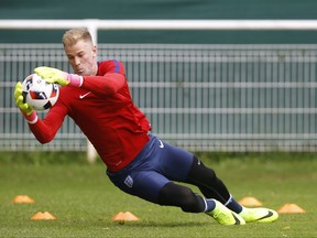 FILE - In this Sunday, June 26, 2016 file photo, England's goalkeeper Joe Hart makes a save during a training session in Chantilly, France. England goalkeeper Joe Hart has completed Wednesday, Aug. 31, 2016, a loan move to Torino from Manchester City. England goalkeeper Joe Hart has joined West Ham on season-long loan it was announced on Tuesday, July 18, 2017, after finding no way back into the Manchester City team under Pep Guardiola. Hart was the first-choice goalkeeper as City won the Premier League in 2012 and 2014. (AP Photo/Kirsty Wigglesworth, File)