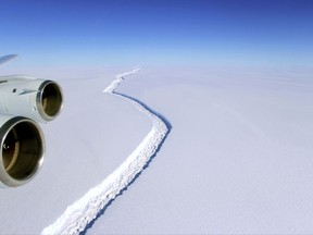 This Nov. 10, 2016 aerial photo released by NASA, shows a rift in the Antarctic Peninsula's Larsen C ice shelf. A vast iceberg with twice the volume of Lake Erie has broken off from a key floating ice shelf in Antarctica, scientists said Wednesday July 12, 2017 . The iceberg broke off from the Larsen C ice shelf, scientists at the University of Swansea in Britain said. The iceberg, which is likely to be named A68, is described as weighing 1 trillion tons (1.12 trillion U.S. tons).(John Sonntag/NASA via AP)
