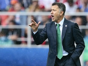 FILE - In this file photo dated Sunday, July 2, 2017, Mexico soccer coach Juan Carlos Osorio gives indications during the Confederations Cup, third place soccer match between Portugal and Mexico, at the Moscow Spartak Stadium.  FIFA on Friday July 7, 2017, banned Osorio for six matches for insulting match officials, effectively banning him from the Gold Cup. (AP Photo/Denis Tyrin, FILE)