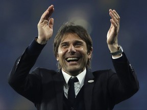 FILE - In this Monday, May 15, 2017 file photo, Chelsea's manager Antonio Conte celebrates after the English Premier League soccer match between Chelsea and Watford at Stamford Bridge stadium in London. Conte has signed a new two-year contract with the English Premier League champions. "I am very happy to have signed a new contract with Chelsea," Conte said on the club's website on Tuesday, July 18, 2017.  (AP Photo/Matt Dunham, File)