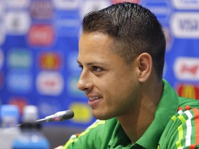 FILE - A Wednesday, June 28, 2017, file photo of  Javier Hernandez speaking during a news conference at the Fisht Stadium in Sochi, Russia.  Hernandez is heading back to the Premier League with West Ham. The London club said Thursday, July 20, 2017,  it has agreed terms with Bayer Leverkusen for the transfer of Hernandez, who was previously at Manchester United from 2010 to 2015. (AP Photo/Sergei Grits, File)