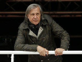 FILE - In this Monday, May 23, 2016 file picture, former Romanian tennis ace Ilie Nastase watches a match of the French Open tennis tournament at the Roland Garros stadium, in Paris, France. Suspended by the International Tennis Federation for his foul-mouthed outbursts, former tennis star Ilie Nastase is now facing a divorce, Romanian media reported Thursday July 13, 2017. (AP Photo/Alastair Grant, File)