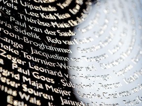 Names of the victims during the revealing of the National Monument for the MH17 in Vijfhuizen, The Netherlands, Monday, July 17, 2017. Relatives and friends of people killed 3 years ago when a surface-to-air missile blew a Malaysia Airlines passenger jet out of the sky over Ukraine are marking the anniversary together with the Dutch king at a new memorial near the Amsterdam airport from which the plane departed. (Remko de Waal/ Pool via AP)