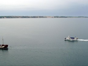 FILE - In this file photo dated May 2005, tourist boats sail in the Piran bay, part of the Adriatic Sea near Portoroz, Slovenia.  Croatia and Slovenia failed on Wednesday July 12, 2017, to reach an mutual agreement on implementing a previous international arbitration ruling granting Slovenia unhindered access to the Adriatic Sea, in a long-standing border dispute stemming from the breakup of Yugoslavia in the 1990s. (AP Photo/Denis Sarkic, FILE)