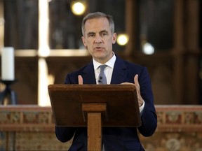 The Governor of the Bank of England, Mark Carney speaks, during the ceremony to unveil the new 10 pound note, at Winchester Cathedral, in Winchester, England, Tuesday July 18, 2017. Two hundred years to the day since Jane Austen was laid to rest at Winchester's grand cathedral, Bank of England Governor Mark Carney has unveiled a new 10-pound note that features one of Britain's most-loved authors. (Steve Parsons/PA via AP)