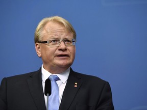 Minister of defence Peter Hultqvist during a press conference at Rosenbad, the Swedish government headquarters, in Stockholm Thursday July 27, 2017.  Prime minister Stefan Lofven announces the removal of two government ministers in response to a no-confidence motion by the opposition Alliance coalition, and Hultqvist will remain in the cabinet. (Erik Simander / TT via AP)