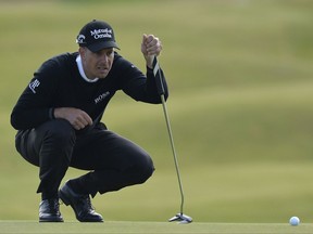 Henrick Stenson of Sweden looks over his putt at the 5th hole during day one of the  Scottish Open at Dundonald Links, Troon, Scotland Thursday July 13, 2017. (Mark Runnacles/PA via AP)