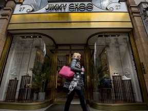 FILE - This is a  April 24, 2017 file photo of  the Jimmy Choo shop on New Bond Street, London. American fashion brand Michael Kors has bought luxury shoemaker Jimmy Choo in a deal worth $1.35 billion (896 million pounds.) Kors said Tuesday July 25, 2017  the London-listed Jimmy Choo is "the ideal partner" that will be bolstered with further development of its online presence.  (Lauren Hurley/PA, File via AP)