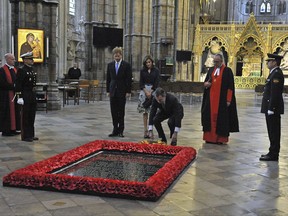 Britain's Prince Harry, centre left, stands with  Spain's King Felipe, centre right,  and Queen Letizia , as the King lays a wreath at the grave of the Unknown Warrior at Westminster Abbey in London, Thursday July 13, 2017.  Spain's royal couple are on the second day of a 3-day State Visit to Britain (Nick Ansell/PA Wire(/PA via AP)