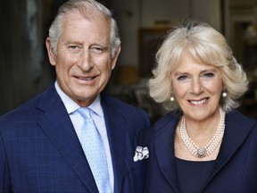 CORRECTS NAME  This photo taken in May 2017 shows Britain's Prince Charles and his wife Camilla, Duchess of Cornwall in Clarence House, London. The photograph has been released by Clarence House to mark the Duchess of Cornwall's 70th birthday. (Mario Testino via Clarence House via AP)