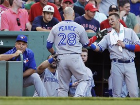 Toronto Blue Jays' Steve Pearce (28) is congratulated by Troy Tulowitzki, right, after his solo home run off Boston Red Sox starting pitcher Eduardo Rodriguez during the second inning of a baseball game at Fenway Park in Boston, Monday, July 17, 2017.(AP Photo/Charles Krupa)