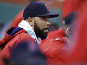 Boston Red Sox starting pitcher David Price sits in the dugout in the seventh inning during a baseball game against the Kansas City Royals at Fenway Park, Friday, July 28, 2017, in Boston. The Red Sox announced that Price was added to the 10-day disabled list prior to the game. (AP Photo/Charles Krupa)