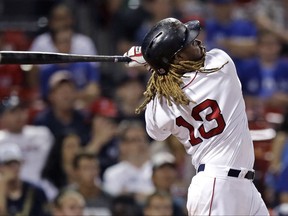 Boston Red Sox's Hanley Ramirez follows through on his game-winning solo home run during the 15th inning of the team's baseball game against the Toronto Blue Jays at Fenway Park in Boston, early Wednesday, July 19, 2017. The Red Sox won 5-4. (AP Photo/Charles Krupa)