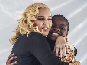 Madonna hugs her Malawian adopted daughter Mercy James after she made a speech during the opening ceremony of the Mercy James Children's Hospital at Queen Elizabeth Central Hospital in Blantyre, Malawi, on July 11, 2017.
