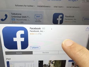 This Monday, June 19, 2017, photo shows Facebook launched on an iPhone, in North Andover, Mass. Facebook is working on a way for news organizations to charge readers for articles they share and read on the social network. Facebook's head of news partnerships, Campbell Brown, says the current plan is to require payments after reading 10 articles from a publisher through Facebook. Brown said at a conference in New York on Tuesday, July 18, 2017, that news organizations have been calling for subscription capabilities. (AP Photo/Elise Amendola)