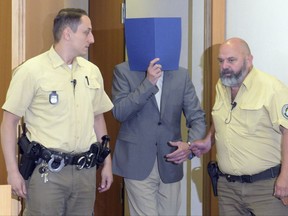 FILE - In this June 16, 2017 file photo defendant Hans D. arrives at the court in Augsburg, Germany. The Bavarian court has convicted the Buddhist monk of more than 25 counts of sexually abusing children and sentenced him to seven years, nine months in prison. The dpa news agency reported Tuesday July 11, 2017 that the 62-year-old man was convicted in Augsburg state court of abusing seven children, between ages 4 to 13, over a period of almost 15 years.  (Stefan Puchner/dpa via AP)