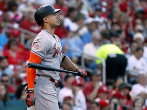 Miami Marlins' Giancarlo Stanton tosses his bat after striking out during the third inning of a baseball game against the St. Louis Cardinals Monday, July 3, 2017, in St. Louis. (AP Photo/Jeff Roberson)