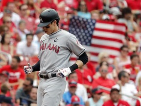 Miami Marlins' Christian Yelich arrives home after hitting a three-run home run during the sixth inning of a baseball game against the St. Louis Cardinals, Tuesday, July 4, 2017, in St. Louis. (AP Photo/Jeff Roberson)