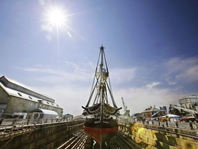 ADDS THAT THIS IS THE OLDEST COMMISSIONED WARSHIP STILL AFLOAT- In this Monday, July 17, 2017 photo the USS Constitution, "Old Ironsides," the world's oldest commissioned warship still afloat, sits in dry dock in Boston after a more then two year long restoration. The ship is scheduled to be refloated overnight Sunday July 23, 2017 and be docked back at its berth Monday morning. (AP Photo/Stephan Savoia)