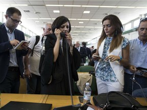 Massimo Carminati's lawyer, Ippolita Naso, talks at the phone in the bunker court of the Rebibbia prison after the reading of the sentence of verdict, delivered at the end of a corruption trial in Rome, Thursday,  July 20, 2017.