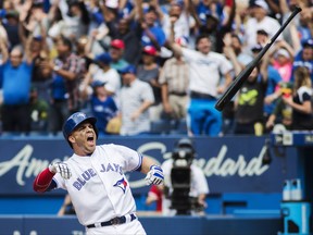 Toronto Blue Jays' Steve Pearce throws the bat in celebration after hitting a walk off grand slam to defeat the Oakland Athletics during the 10th inning of MLB baseball action in Toronto, Thursday July 27, 2017. THE CANADIAN PRESS/Mark Blinch