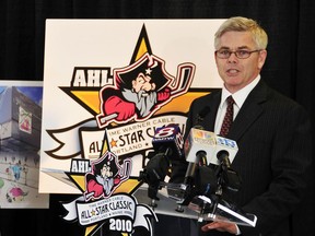 FILE - In this Thursday, April 23, 2009 file photo, Dave Andrews, president and CEO of the American Hockey League, announces that the AHL all-star game will be played at the Portland Civic Center in 2010 in Portland, Maine. Players on American Hockey League contracts will be eligible to play in the 2018 Winter Olympics. President and CEO David Andrews confirmed through a league spokesman Wednesday, July 19, 2017 that teams were informed they could loan players on AHL contracts to national teams for the purposes of participating in the Pyeongchang Olympics. (Gordon Chibroski/Portland Press Herald via AP, File)