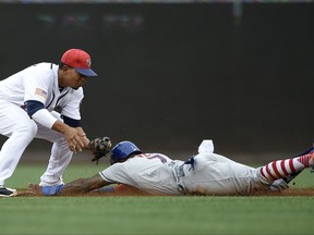 New York Mets' Jose Reyes, right, is out trying to steal second against Washington Nationals shortstop Adrian Sanchez, left, during the third inning of a baseball game, Monday, July 3, 2017, in Washington. (AP Photo/Nick Wass)