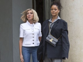 Brigitte Macron, left, the wife of French President Emmanuel Macron welcomes Singer Rihanna at the Elysee Palace to meet French President Emmanuel Macron in Paris, France, Wednesday, July 26, 2017. Global Ambassador for the Global Partnership for Education Rihanna meet French President Emmanuel Macron to discuss France's contributions to the Global Partnership for Education. (AP Photo/Michel Euler)