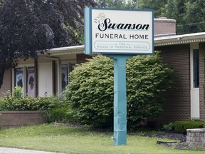 A light rain falls on Swanson Funeral Home on Wednesday, July 12, 2017, on Martin Luther King Avenue in Flint, Mich. The state has shut down the funeral home, saying maggots were in a garage where unrefrigerated bodies were being stored. (Terray Sylvester/The Flint Journal-MLive.com via AP)