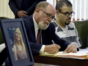 Daniel Clay, right, sits with defense attorney Russell A. Smith as he listens during his sentencing, Thursday, July 13, 2017 in Monroe, Mich. Daniel Clay will spend the rest of his life in prison for killing a woman after a 2014 Halloween party in southeastern Michigan and stashing her body in the woods. (Tom Hawley/The Monroe News via AP)