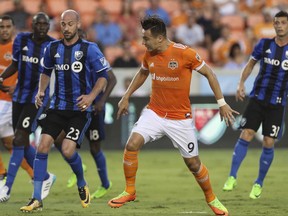 Houston Dynamo forward Erick Torres (9) attempts a header with a free kick during the first half of a soccer game against the Montreal Impact, Wednesday, July 5, 2017, in Houston. (Yi-Chin Lee /Houston Chronicle via AP)