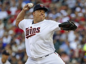 Minnesota Twins starting pitcher Bartolo Colon throws to the New York Yankees in the first inning of a baseball game Tuesday, July 18, 2017, in Minneapolis. (AP Photo/Bruce Kluckhohn)