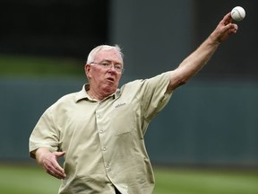 Former Minnesota Twins manager Tom Kelly throws a ceremonial first pitch as part of a 30th anniversary celebration of the 1987 World Series Champion team before a baseball game with the Detroit Tigers, Friday, July 21, 2017, in Minneapolis. (AP Photo/Bruce Kluckhohn)