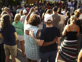 A crowd gathers to remember Justine Damond on Sunday evening, July 16, 2017 in Minneapolis.
