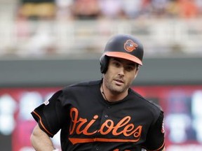 Baltimore Orioles' Seth Smith rounds the bases after hitting a home run during the first inning of the team's baseball game against the Minnesota Twins, Friday, July 7, 2017, in Minneapolis. (AP Photo/Paul Battaglia)