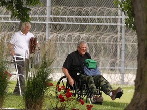 FILE - In this June 22, 2016, file photo, former Speaker of the House Dennis Hastert, right, reports to the Federal Medical Center in Rochester, Minn., to begin serving a sentence in a hush money case. Federal Bureau of Prisons records on Tuesday, July 18, 2017, show that Hastert has been released from the Minnesota federal prison and transferred to a Chicago re-entry facility. Records list his release date as Aug. 16.  (Andrew Link/The Rochester Post-Bulletin via AP, File)