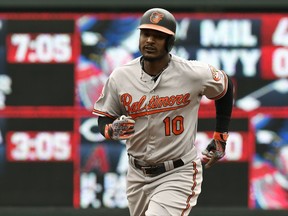 Baltimore Orioles' Adam Jones rounds second base with a three-run home run off Minnesota Twins pitcher Kyle Gibson in the first inning of a baseball game Sunday, July 9, 2017, in Minneapolis. (AP Photo/Tom Olmscheid)