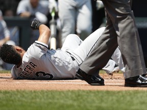 Chicago White Sox's Melky Cabrera falls after getting hit by his foul ball in the first inning of his team's baseball game against the Kansas City Royals at Kauffman Stadium in Kansas City, Mo., Sunday, July 23, 2017. (AP Photo/Colin E. Braley)