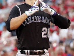 Colorado Rockies' Nolan Arenado looks skyward after hitting a two-run home run during the first inning of a baseball game against the St. Louis Cardinals Wednesday, July 26, 2017, in St. Louis. (AP Photo/Jeff Roberson)
