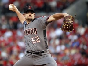 Arizona Diamondbacks starting pitcher Zack Godley throws during the first inning of the team's baseball game against the St. Louis Cardinals on Thursday, July 27, 2017, in St. Louis. (AP Photo/Jeff Roberson)