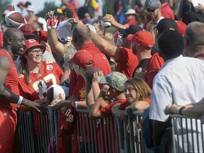 Kansas City Chiefs linebacker Justin Houston poses for a photo with fan Mica Stiffle, 16, of Goddard, Kan., Friday, July 28, 2017, at the NFL football team's training camp in St. Joseph, Mo. (Jessica A. Stewart/The St. Joseph News-Press via AP)